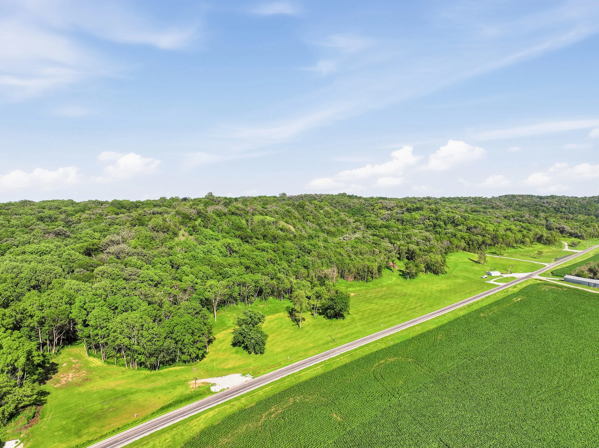 Aerial view of the wooded bluffs and valley at Glacier Ridge, Sidney, Iowa